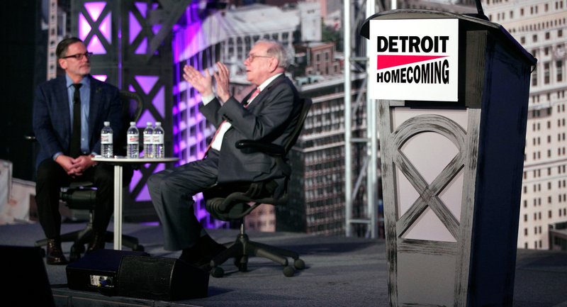 Dan Gilbert & Warren Buffett talk at an invite-only “Detroit Homecoming” event. (Photo credit: Bill Pugliano/Getty)